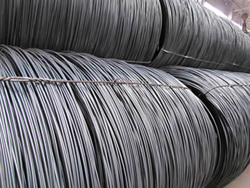 Plain PC Wire — coiled spools in warehouse
