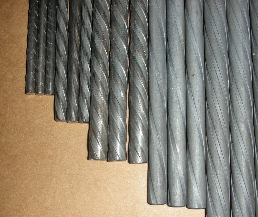 PC Spiral Wire — coiled spools in warehouse